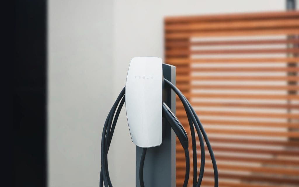 Telsa ev charger mounted on a pedestal